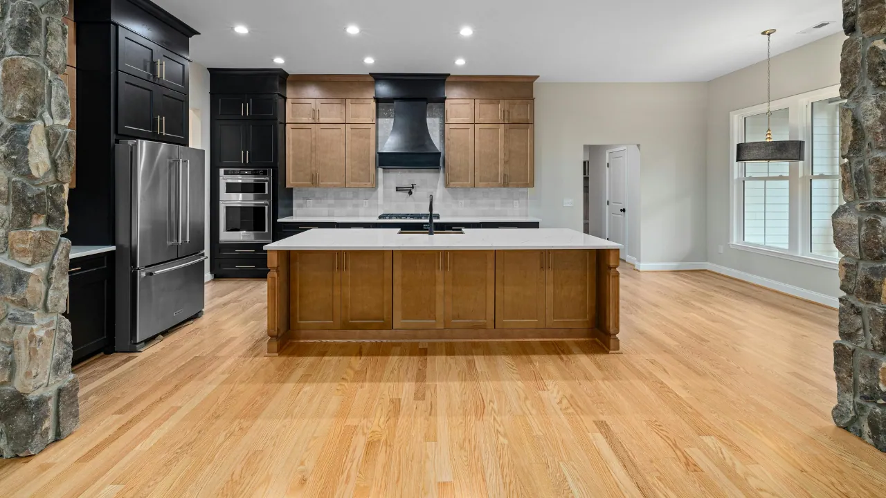 Hardwood flooring running through a modern kitchen
